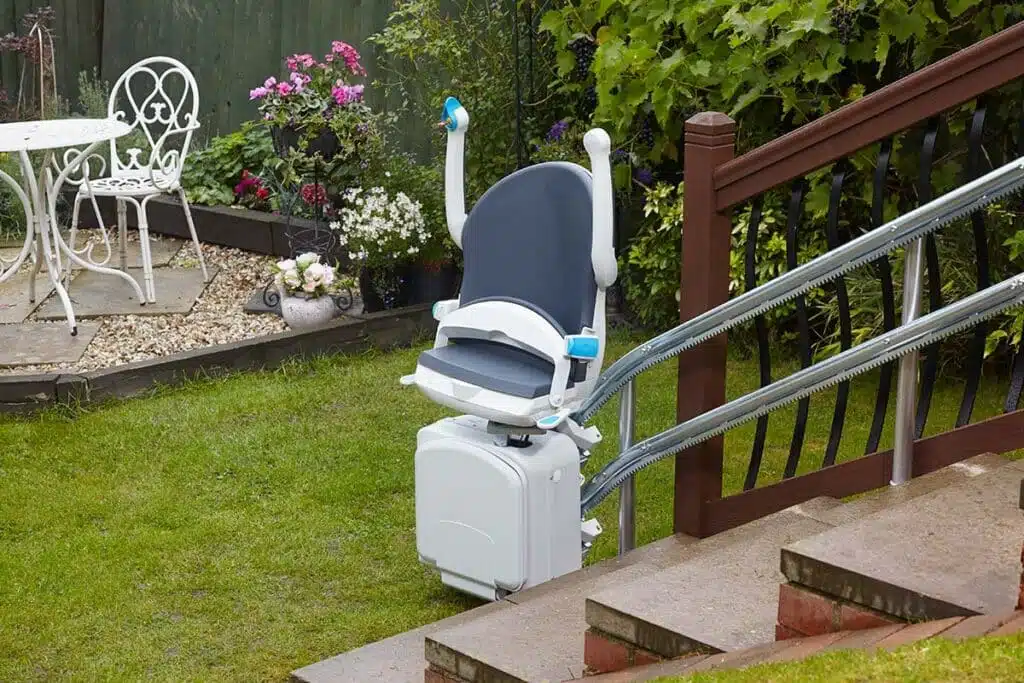 Handicare curved stairlift 2000 Smart saphire outdoor arms up 1200x800