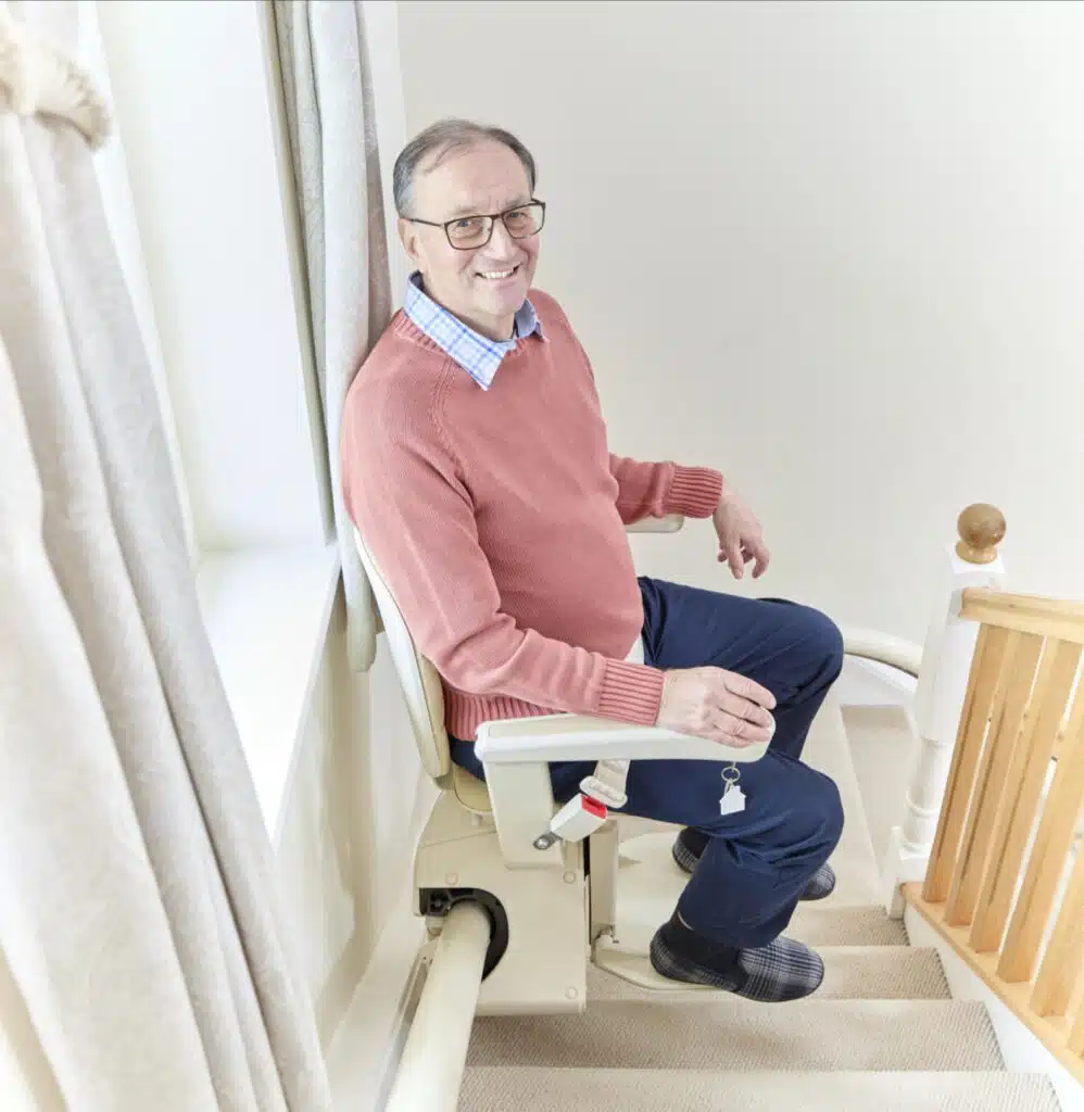 old man stitting on stairlift old man stitting on stairlift